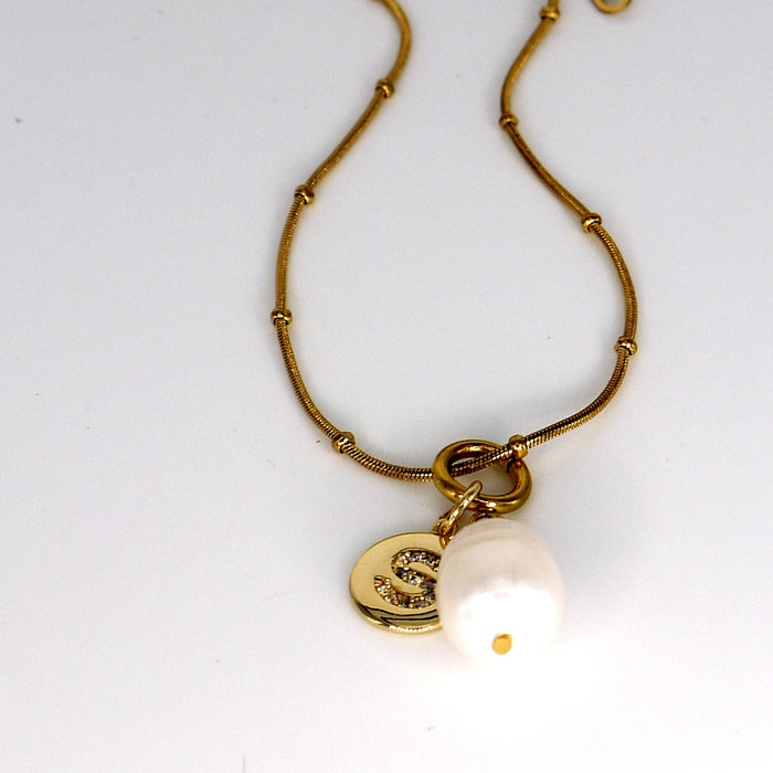 Pearl & Initial Tag Necklace – flat lay
