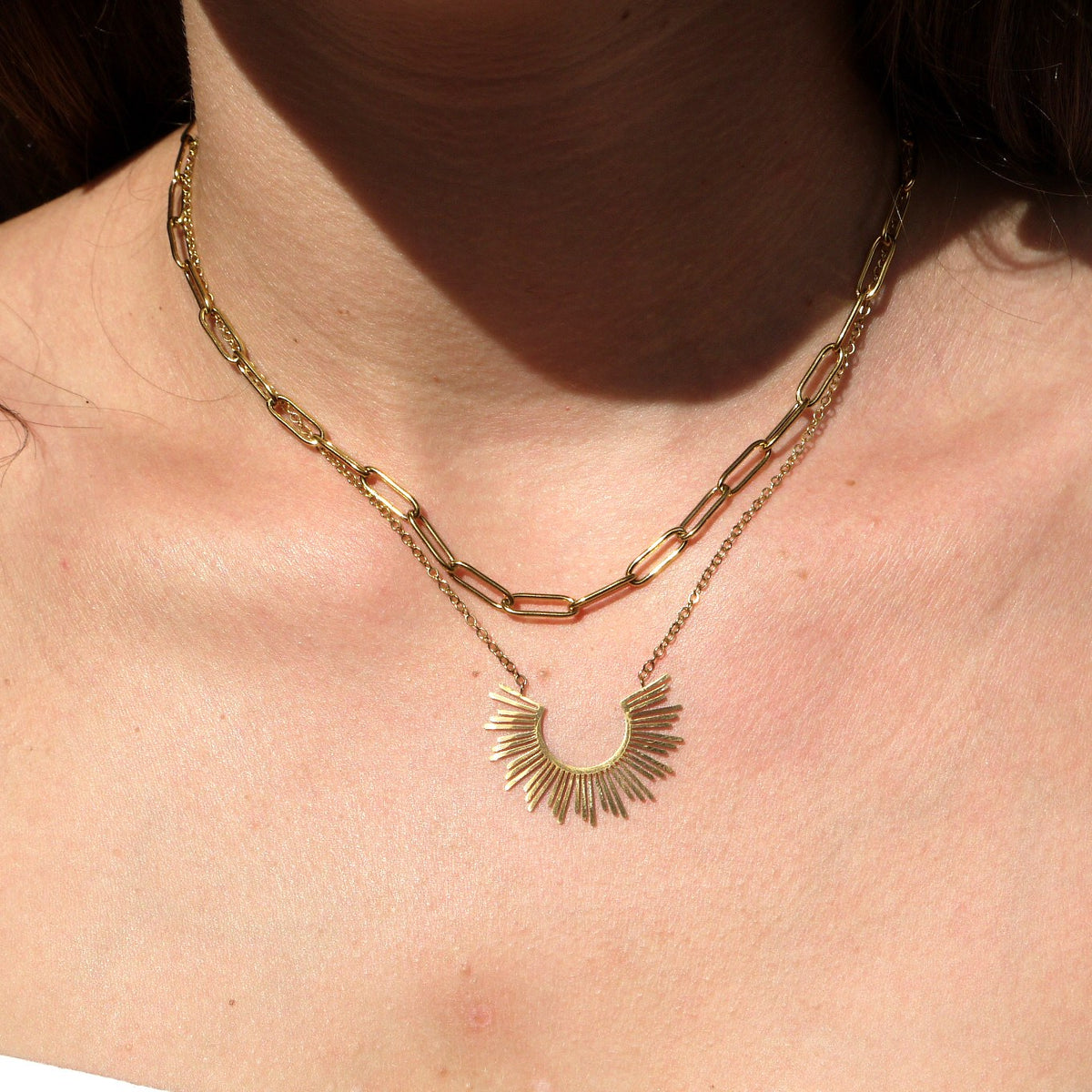 Sunburst pendant double chain necklace worn